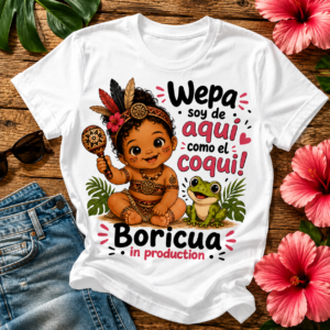 Boricua in Production pregnancy announcement T-shirt featuring a Taíno-inspired baby, coquí frog, and Puerto Rican cultural artwork.