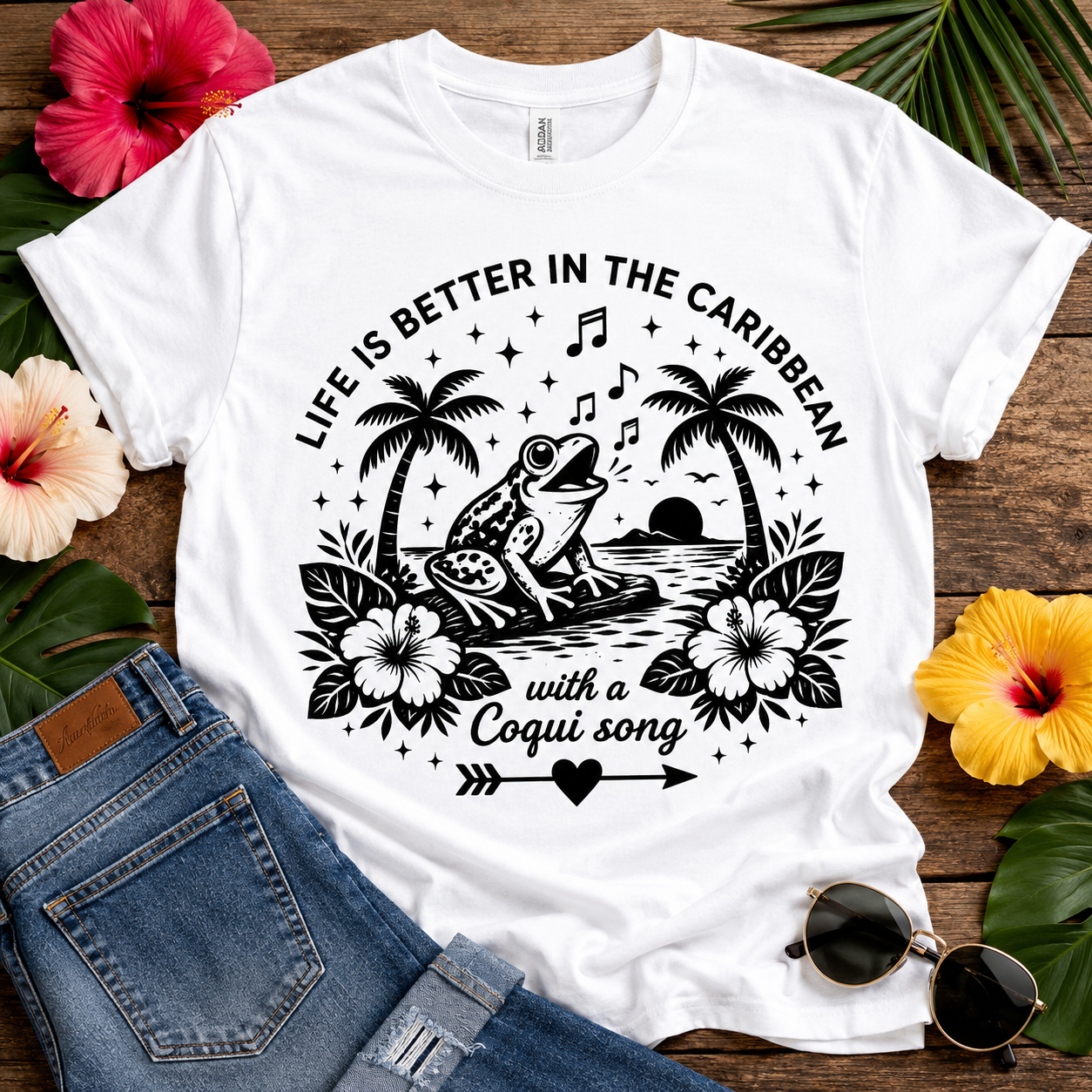 Coquí Song T-shirt featuring a singing Puerto Rican coquí frog, tropical sunset, palm trees, hibiscus flowers, musical notes, and the phrase "Life Is Better in the Caribbean."