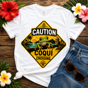 Caution Coquí Crossing T-shirt featuring a Puerto Rican coquí frog with tropical scenery in a vintage road sign design inspired by Taíno heritage.