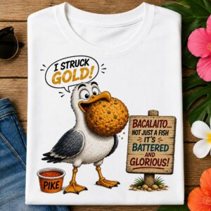 Funny Seagull Fish Bait T-Shirt featuring a happy seagull celebrating with the quote "I Struck Gold!" on a tropical beach.
