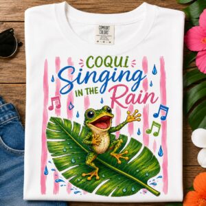 Coquí Singing T-Shirt featuring a happy tropical frog singing in the rain with colorful Puerto Rican nature artwork.