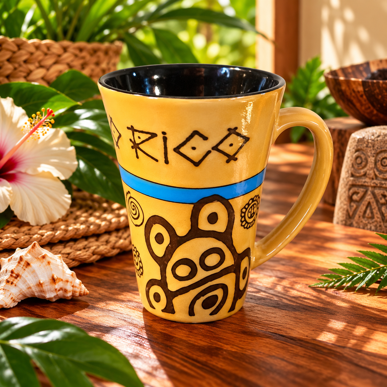 Puerto Rican ceramic mug with Taíno-inspired brown symbols, blue band, golden-yellow glaze and black interior